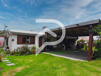 Maison chaleureuse avec un beau jardin