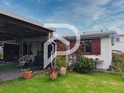 Maison chaleureuse avec un beau jardin